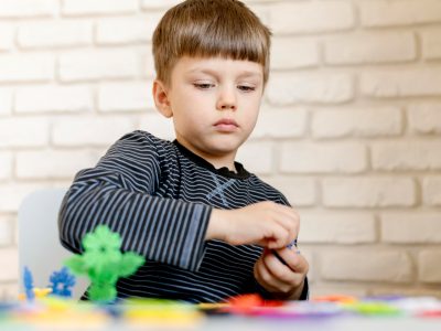 little-kid-playing-indoors-min