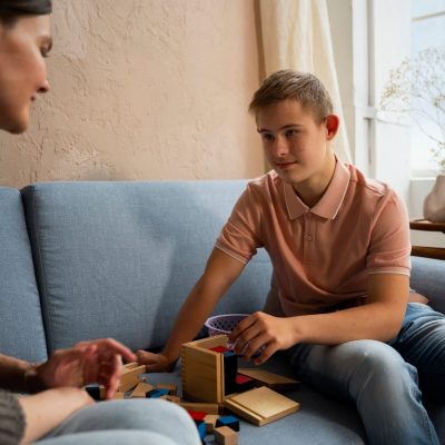 side-view-woman-boy-sitting-couch-min